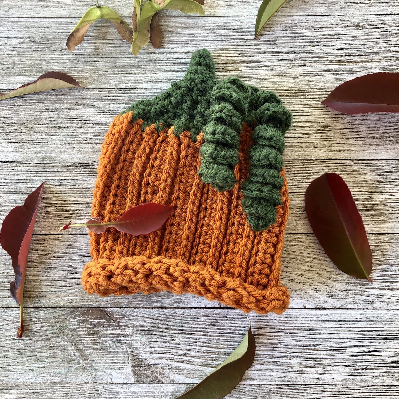 Crochet pumpkin baby hat pattern by www.itchinforsomestitchin.com