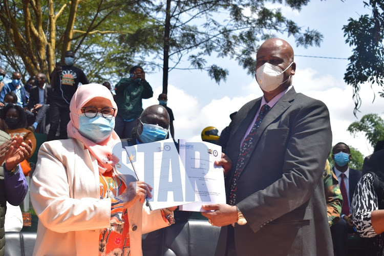 UN Habitat Kenya Executive Director Maimunah Mohd Sharif and Nairobi Metropolitan Services Director General Mohammed Badi display signed MOU on Nairobi River Regeneration at Michuki's People's Park on July 14, 2021.