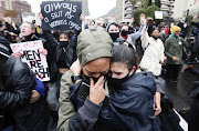 Two gender-based violence protesters during a protest at parliament in Cape Town on August 29 2020.