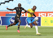 Peter Shalulile of Mamelodi Sundowns challenged by Zukile Mkhize of Royal AM during the DStv Premiership 2021/22 football match between Sundowns and Royal AM at Loftus Stadium, Pretoria.