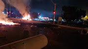 Illegal land and RDP house grabbers have barricaded roads with burning tyres and objects in Olievenhoutbosch, near Centurion. 