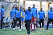 Pitso Mosimane and his bench protest to the referee after a decision went against his team during a match.  