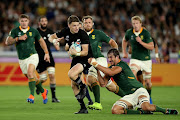 Beauden Barrett of the All Blacks makes a break during the Rugby World Cup 2019 Group B game between New Zealand and South Africa at International Stadium Yokohama on September 21, 2019 in Yokohama, Kanagawa, Japan. 