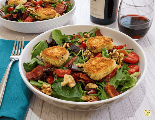 A delicious bowl of French bistro Salad with Warm Goat Cheese en Croûte.