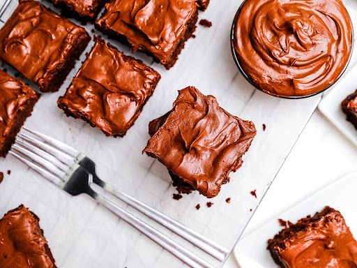Frosted Fudge Brownies cut into squares.