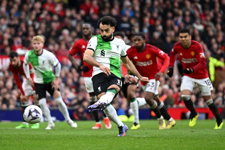 Mohamed Salah scores Liverpool's second goal from the penalty spot in their Premier League draw with Manchester United at Old Trafford on Sunday.