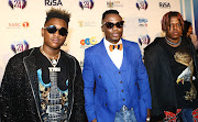 Dj Tira, flanked by members of the Destruction Boyz, on the red carpet before the start of the 2018 South African Music Awards.

