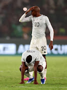 Bafana Bafana players Aubrey Modiba and Khuliso Mudau look dejected after their defeat to Nigeria in the semifinal of the Africa Cup of Nations on Wednesday night.