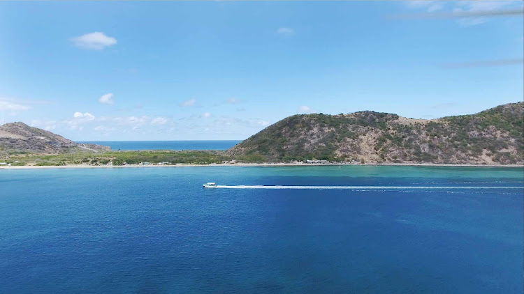 Drone image of Frigate Bay in St. Kitts, with the Atlantic on the far side and Caribbean on the near side.