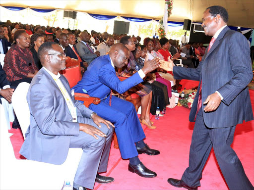 DP William Ruto and Wiper leader Kalonzo Musyoka at the consecration of bishop Philip Kitoto of Kenya Assemblies of God in Nairobi yesterday/ DENNIS KAVISU