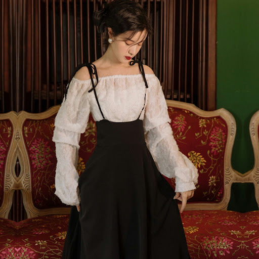 Title 7, Clear long-sleeved white top with suspender ski...