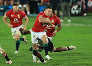 Josh Adams of the British & Irish Lions, who scored four tries in the match, breaks clear for his first try during the game against the Gauteng-based Lions in Johannesburg on July 3 2021. 