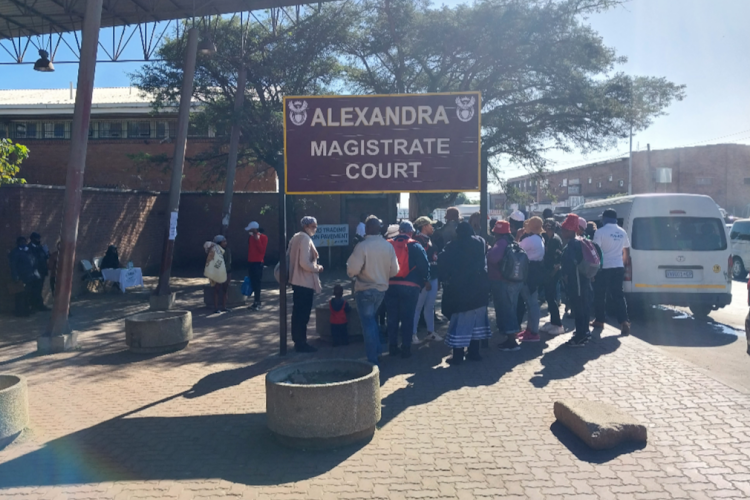 Dudula movement members gathered outside the Alexandra magistrate's court on Thursday in support of the six accused.