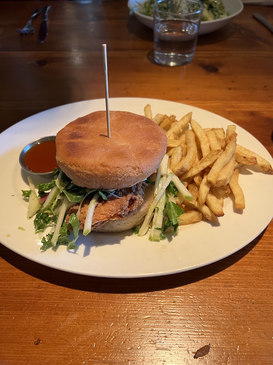 Hot Honey Fried Chicken Sandwich - gluten free bun, kale & apple slaw, lemon aioli, and fries