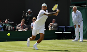 Nick Kyrgios of Australia plays a backhand against Paul Jubb of Great Britain in their first round match on day two of The Championships Wimbledon 2022 on June 28 2022.