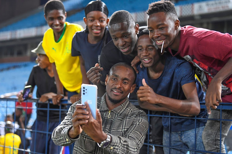 Mamelodi Sundowns coach Rulani Mokwena meets fans and take selfies during the DStv Premiership match against Cape Town City FC at Loftus Versfeld Stadium on April 4 2023.