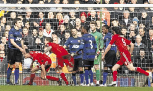 FIRST STRIKE : Liverpool's Daniel Agger, third from left, celebrates scoring against Manchester United during their FA Cup match at Anfield in Liverpool at the weekend. Photo: REUTERS