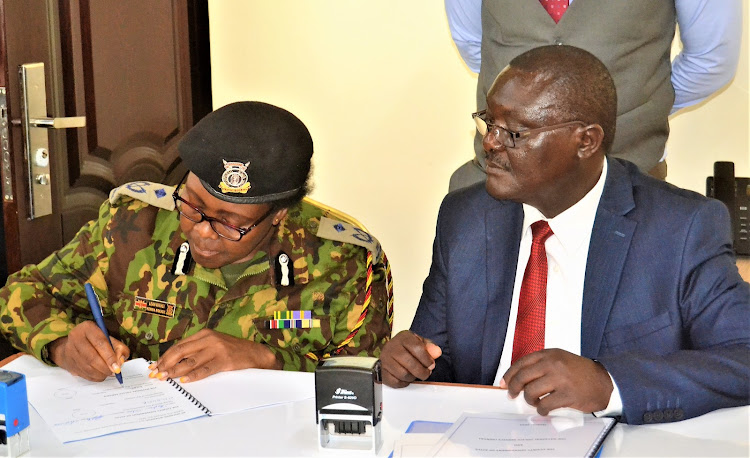 Kitui county police commander Leah Kithei and chief Officer in the Office of the Governor Saleh Kitonga inked the deal in Kitui Governor's board room on Friday, March 24