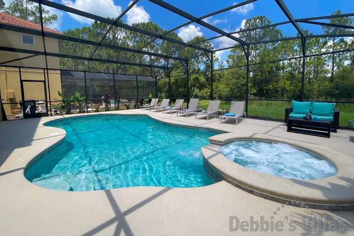 Orlando vacation villa with a scenic view from the extended pool and spa deck