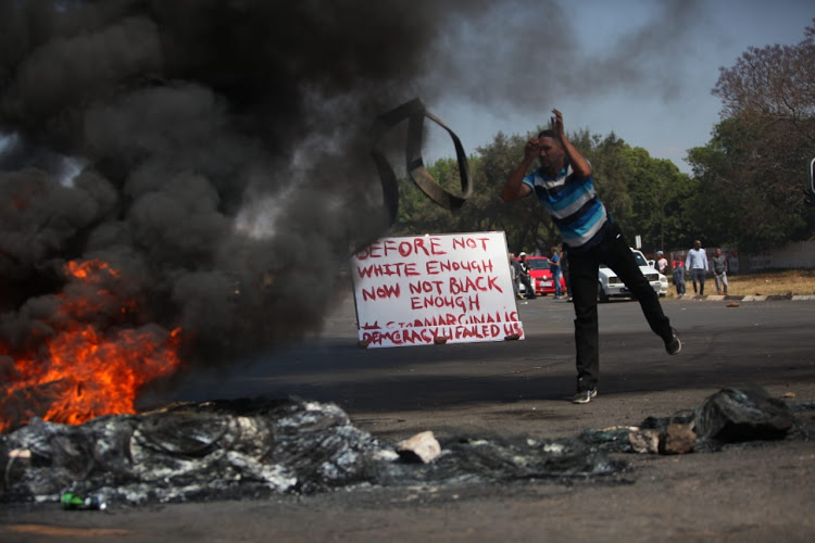 Residents protest against gangsterism and crime in Ennerdale, south of Johannesburg on October 5 2018.