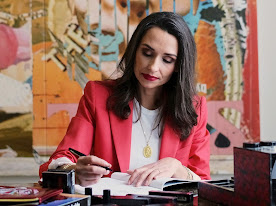 Woman writing in a book