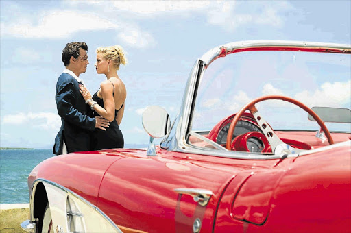 RUM AND BLOKE: Johnny Depp as Paul Kemp and Amber Heard, who plays Chenault, his love interest