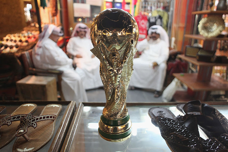 A replica of the Fifa World Cup trophy in a shoe store at the Souq Waqif traditional market in Doha.