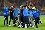 Mamelodi Sundowns players and technical staff celebrate their semifinal victory, with a 0-0 second leg result to make a 1-0 aggregate win, in their African Football League clash against Al Ahly at Cairo International Stadium in Egypt on Wednesday.