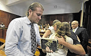 Hardus and Nicolette Lotter make their way out of the Durban High Court yesterday after being sentenced Picture: TEBOGO LETSIE