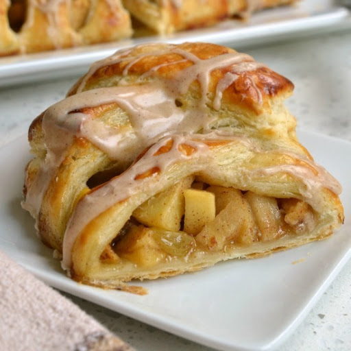 This scrumptiously easy and delicious Apple Strudel is made with flaky buttery puff pastry, fresh crisp apples, plump juicy raisin all drizzled with a sweet cinnamon glaze.