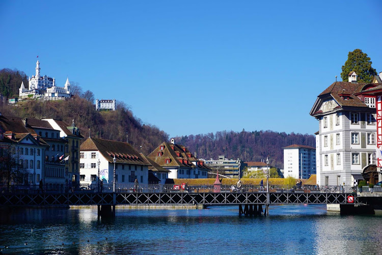 A gorgeous riverside landscape in Lucerne, Switzerland. To the left is the historic 
Château Gütsch hotel.