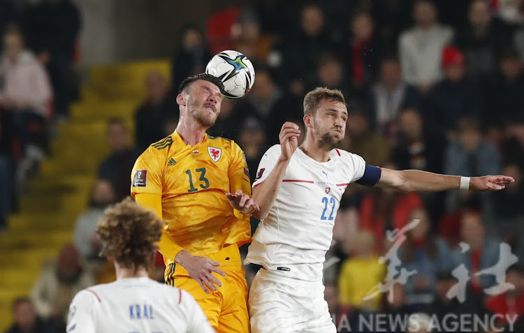 Wales’ Kieffer Moore (L) in action with Czech Republic’s Tomas Soucek during a past match