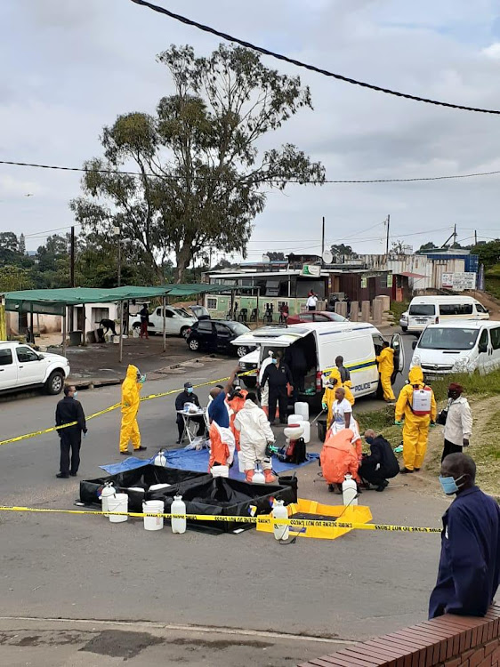 Decontamination teams fumigate the Inanda police station on Wednesday.