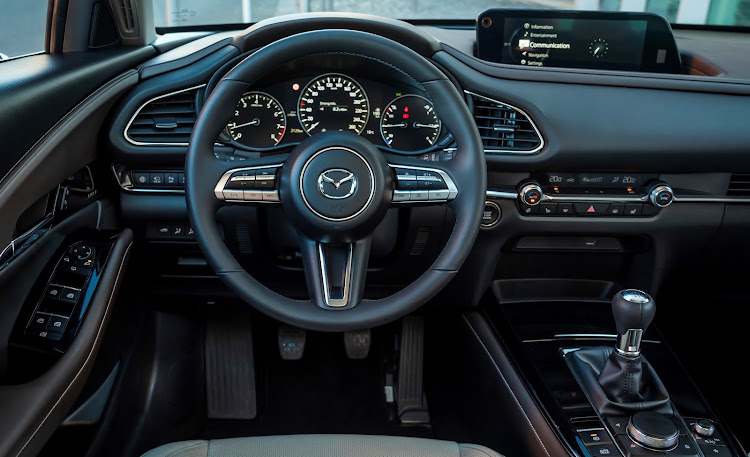 The CX-30 sports a clean, minimalist dashboard design.