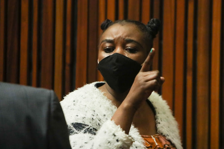 Ndlovu gestures to members of the media after giving testimony during her court appearance on September 14 2021.