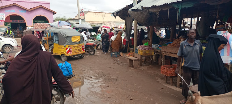 Residents go about their business at the Garissa market. They have been urged to exercise high level of hygiene in order to stop the spread of cholera.
