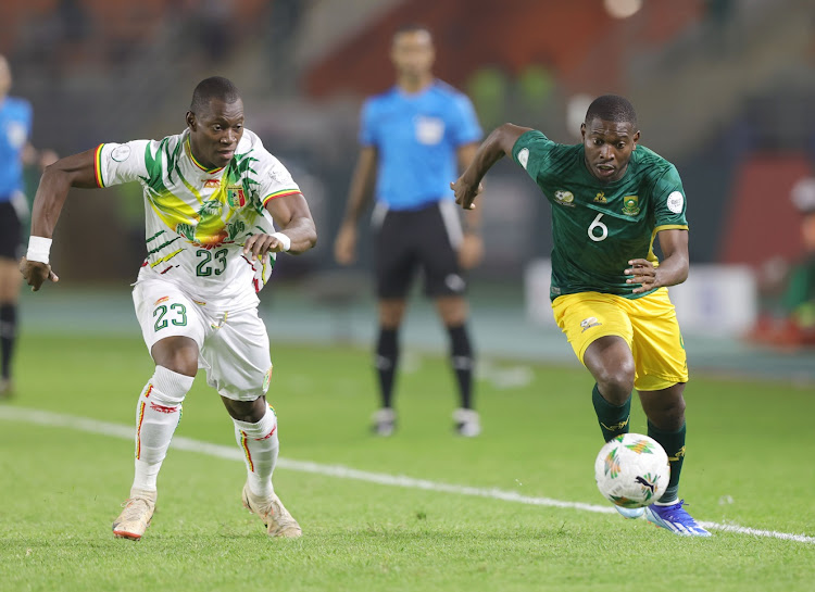 Aubrey Modiba of South Africa is challenged by Aliou Dieng of Mali during their Africa Cup of Nations (Afcon) match at the Amadou Gon Coulibaly Stadium in Korhogo on January 16 2024.