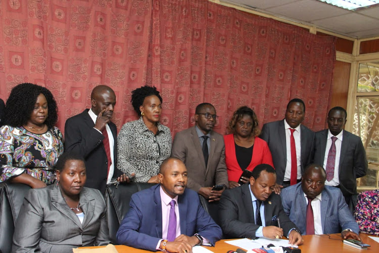 Handshake MPs during a press conference at Parliament buildings on December 4.