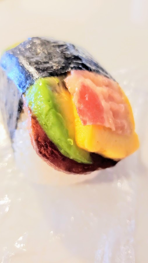 Eats in Oahu - check out Musubi Cafe Iyasume for delicious combinations of musubi, my favorite was one with avocado that could be with egg and bacon as seen here or with eel. They make the musubi to order