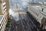 Demonstrators clash with police officers during a protest against Peru's President Pedro Castillo after he had issued a curfew mandate which was lifted following widespread defiance on the streets, as protests spiraled against rising fuel and fertilizer prices triggered by the Ukraine conflict, in Lima, Peru April 5, 2022.  