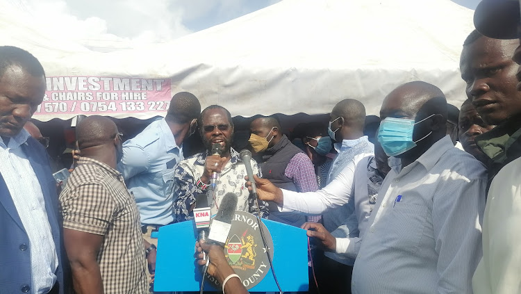 Kisumu Governor Anyang Nyong'o addressing traders at Kibuye market.