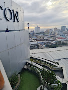 An unidentified woman stood on the edge of the 19-storey high iconic Hilton Hotel in Durban on Friday morning after what is understood to have been an emotional meltdown.