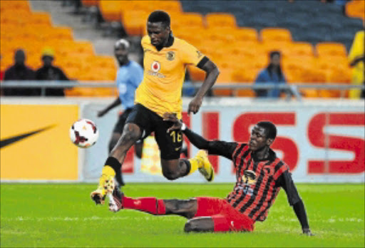 SMALL HURDLE: Kgotso Moleko of Kaizer Chiefs evades a challenge from Emilio Martin of Black Africa during the 2014 CAF Champions League match at FNB Stadium PHOTO: Chris Ricco/BackpagePix