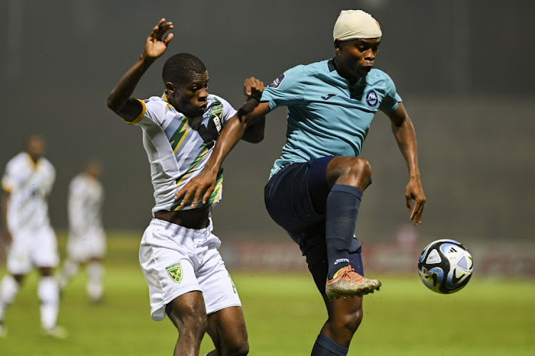 Simphiwe Mcineka of Richards Bay FC and Angelo Van Rooi of Golden Arrows FC during the DStv Premiership match