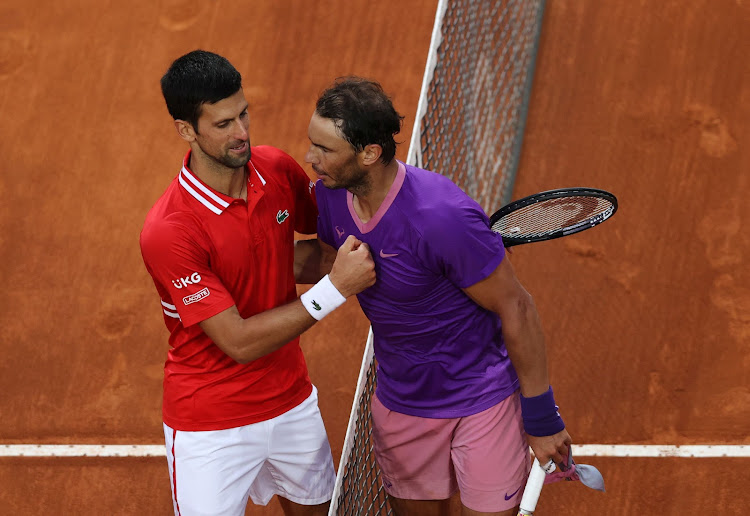 Rafael Nadal of Spain is congratulated by Novak Djokovic of Serbia after the men's final at Foro Italico on May 16, 2021 in Rome