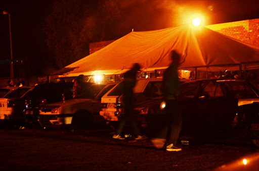 Patrons hang out at a Mavuso stokvel at a village in Hammanskraal, north of Pretoria, on Monday night. Picture: Mduduzi Ndzingi