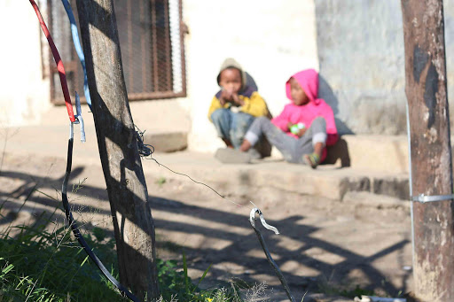 DANGER ZONE: Children in Duncan Village play only metres away from a live illegal electricity line Picture: STEPHANIE LLOYD