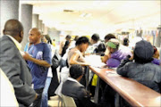 CHOCK-A-BLOCK: Busy day at Polokwane Post Office as people queue for piece of the pie with Sasol Investors Shares. Some people had been waiting since 9am for assistance to submit thier forms. Pic. Nyeleti Machovani. 09/07/2008. © Unknown