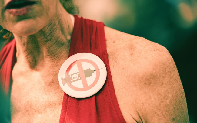 A woman protests against vaccines at a rally in the US.