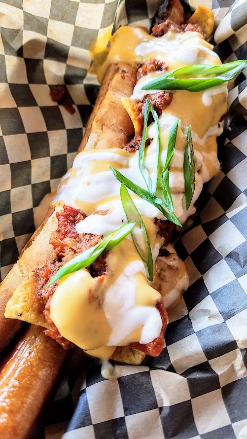 OP Wurst on SE Division, Frito Pie Dog with a pork frankfurter, chili, fritos, beer cheese sauce, sour cream